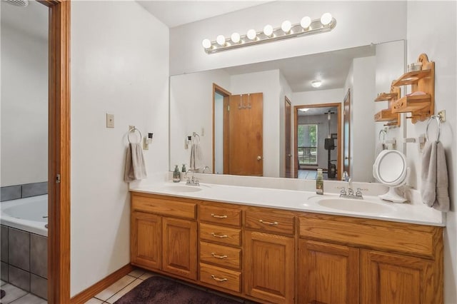 41357 Countryside Ln, Hammond, LA 70403 - bathroom featuring tile patterned flooring, double vanity, and tiled tub