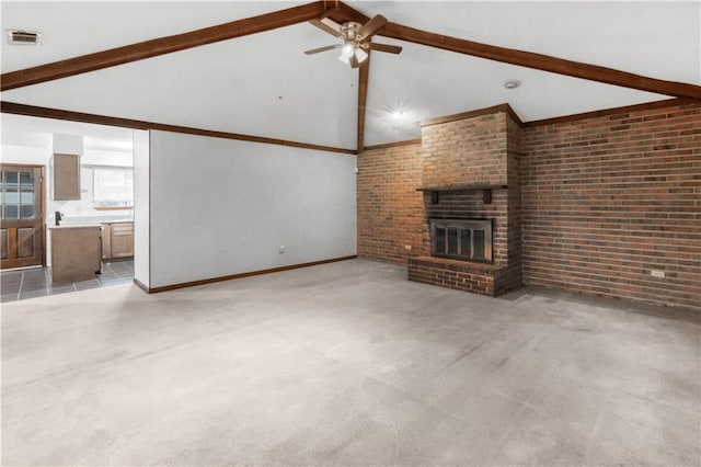 154 Oakwood Dr, Mandeville, LA 70448 - unfurnished living room featuring ceiling fan, a brick fireplace, baseboards, and brick wall