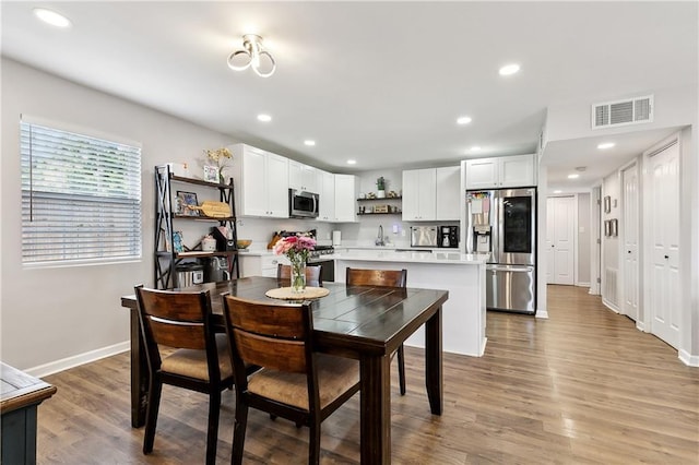 1931 Farmington Pl, Terrytown, LA 70056 - dining room featuring baseboards, recessed lighting, and light wood-type flooring