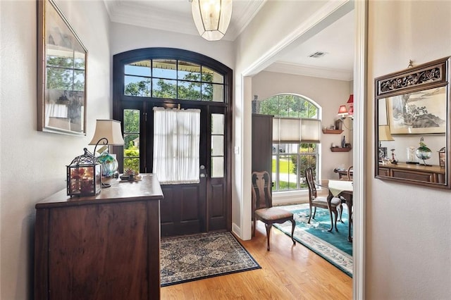 505 Swift Fox Run, Madisonville, LA 70447 - entryway with wood finished floors and ornamental molding