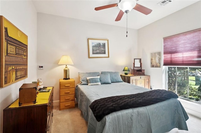 505 Swift Fox Run, Madisonville, LA 70447 - bedroom featuring light carpet, a ceiling fan, and a desk