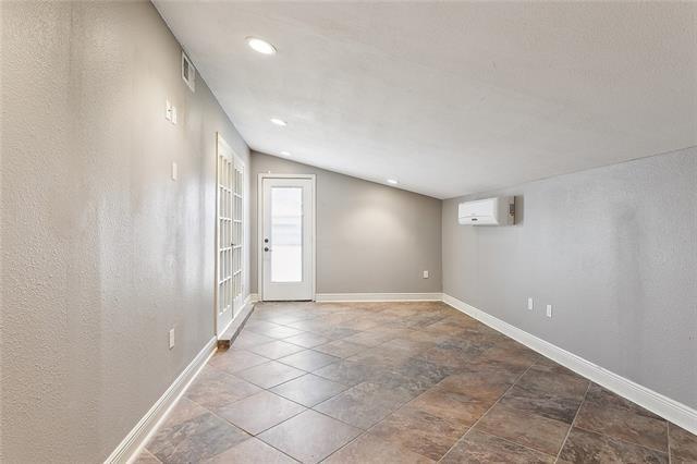 313 Celeste Ave, River Ridge, LA 70123 - spare room featuring an AC wall unit, baseboards, and recessed lighting