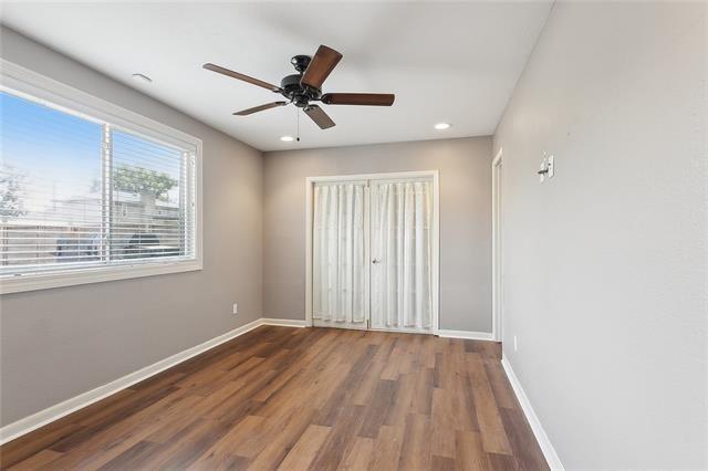 313 Celeste Ave, River Ridge, LA 70123 - unfurnished bedroom with wood finished floors, baseboards, recessed lighting, and ceiling fan