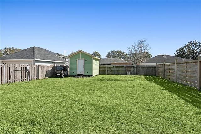 313 Celeste Ave, River Ridge, LA 70123 - view of yard featuring a storage unit and an outdoor structure