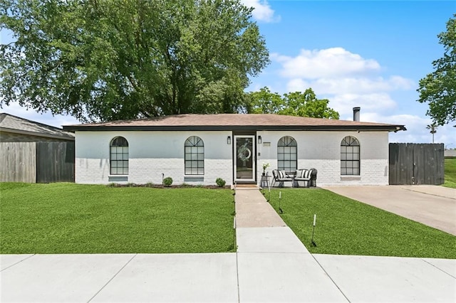 view of front of home featuring brick siding