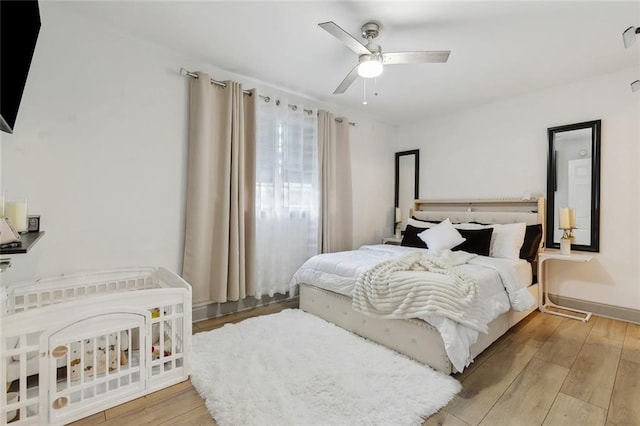 bedroom with wood finished floors and ceiling fan