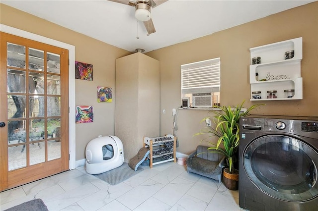laundry area featuring washer / dryer, ceiling fan, and marble look tiles