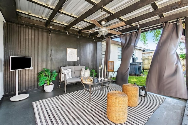 sunroom / solarium featuring ceiling fan and outdoor lounge area