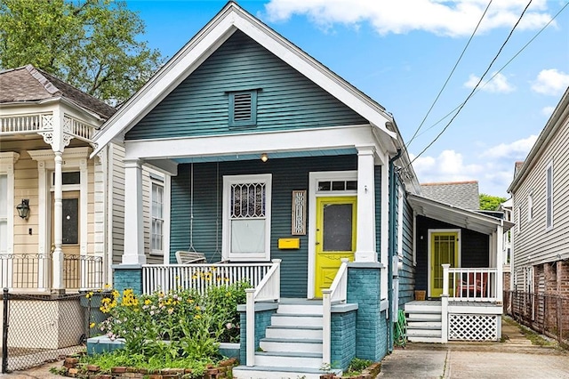 613 Pacific Ave, New Orleans, LA 70114 - shotgun-style home featuring a porch