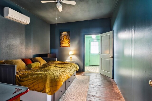 613 Pacific Ave, New Orleans, LA 70114 - bedroom featuring hardwood / wood-style floors, an AC wall unit, and ceiling fan