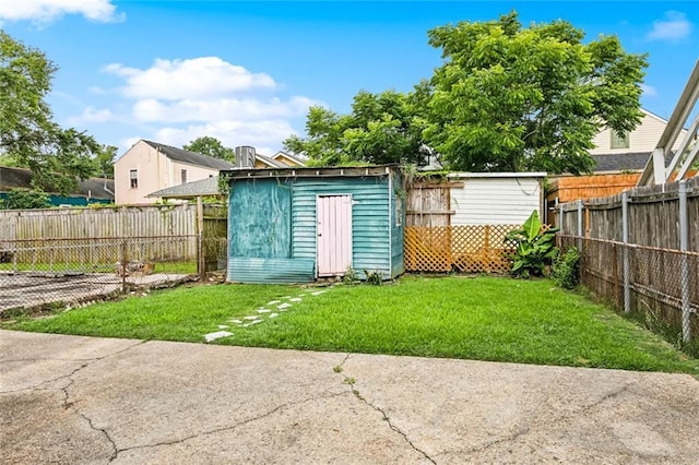613 Pacific Ave, New Orleans, LA 70114 - view of yard with a storage unit and an outdoor structure