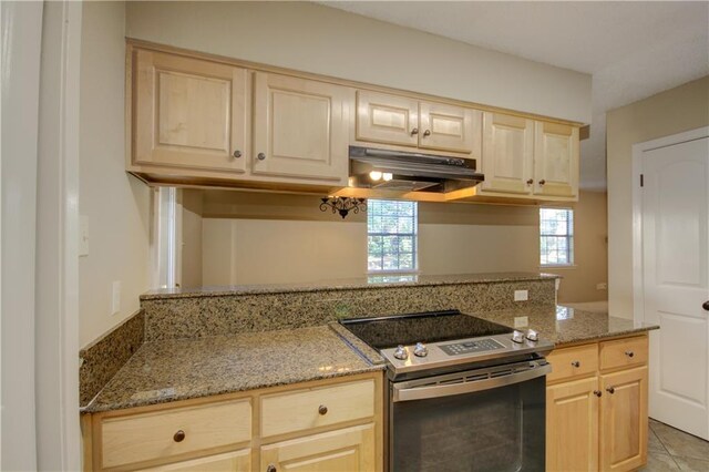 717 Heavens Dr Unit 4, Mandeville, LA 70471 - kitchen featuring stainless steel electric range oven, light brown cabinetry, under cabinet range hood, and light stone countertops