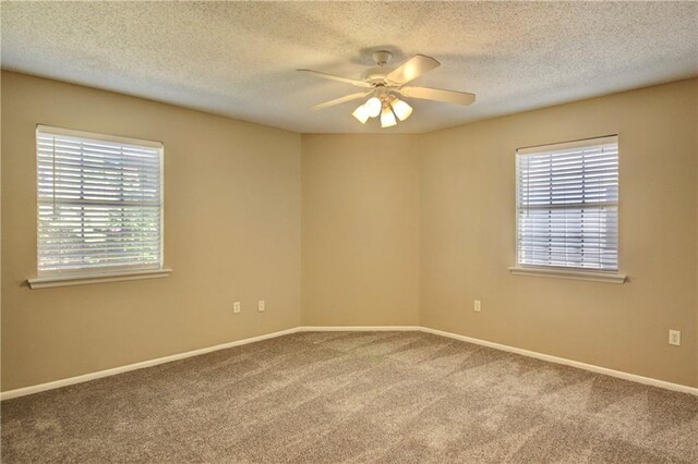 717 Heavens Dr Unit 4, Mandeville, LA 70471 - unfurnished room with carpet flooring, a ceiling fan, baseboards, and a textured ceiling