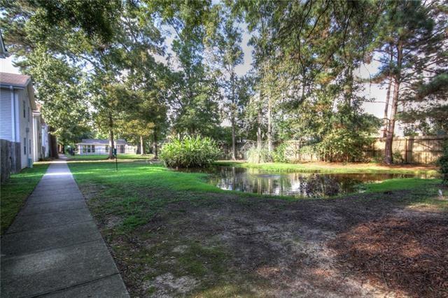 717 Heavens Dr Unit 4, Mandeville, LA 70471 - view of yard featuring a water view