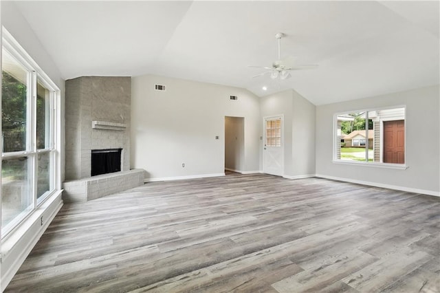 301 Holmes Dr, Slidell, LA 70460 - unfurnished living room featuring lofted ceiling, ceiling fan, wood finished floors, a fireplace, and baseboards