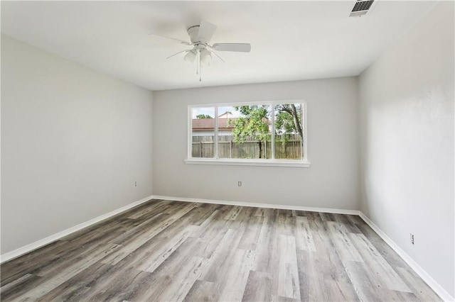 301 Holmes Dr, Slidell, LA 70460 - empty room featuring wood finished floors, ceiling fan, and baseboards