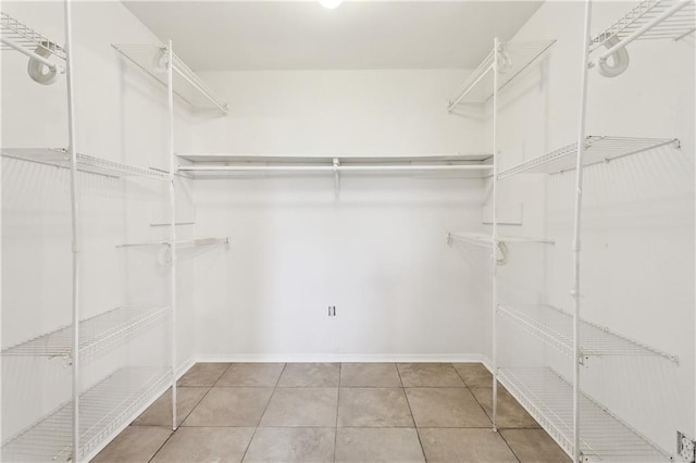 301 Holmes Dr, Slidell, LA 70460 - walk in closet with tile patterned floors