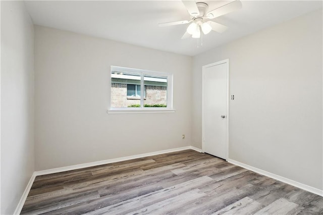 301 Holmes Dr, Slidell, LA 70460 - unfurnished room featuring wood finished floors, baseboards, and ceiling fan