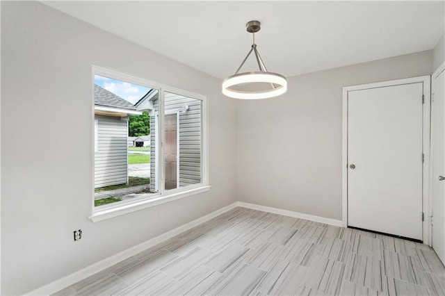301 Holmes Dr, Slidell, LA 70460 - unfurnished dining area featuring baseboards and wood tiled floors
