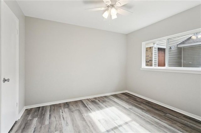 301 Holmes Dr, Slidell, LA 70460 - empty room featuring wood finished floors, baseboards, and ceiling fan