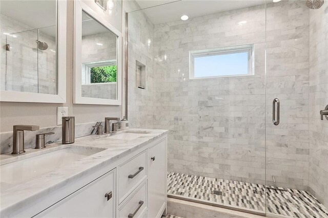 3928 Uri St, Metairie, LA 70002 - bathroom featuring a stall shower and double vanity