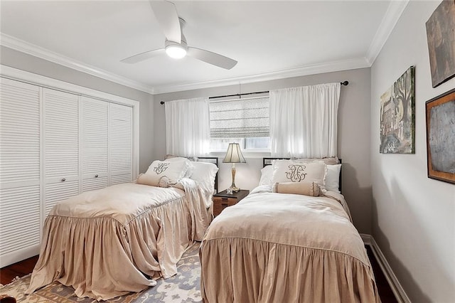 3928 Uri St, Metairie, LA 70002 - bedroom featuring crown molding, a closet, baseboards, a ceiling fan, and wood finished floors