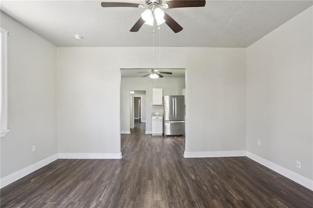 1816 Congress St, New Orleans, LA 70117 - unfurnished living room featuring ceiling fan, dark wood-style flooring, and baseboards