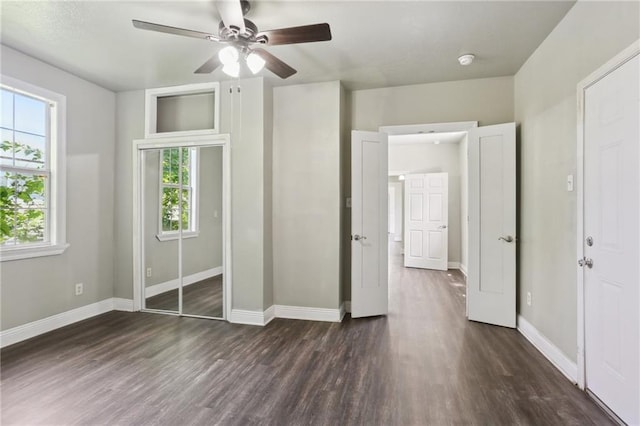 1816 Congress St, New Orleans, LA 70117 - unfurnished bedroom featuring dark wood-type flooring, baseboards, a ceiling fan, and a closet