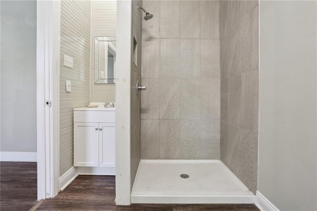 1816 Congress St, New Orleans, LA 70117 - bathroom featuring a stall shower, vanity, wood finished floors, and baseboards
