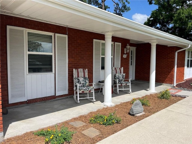242 Willow Dr, Gretna, LA 70053 - entrance to property featuring covered porch and brick siding