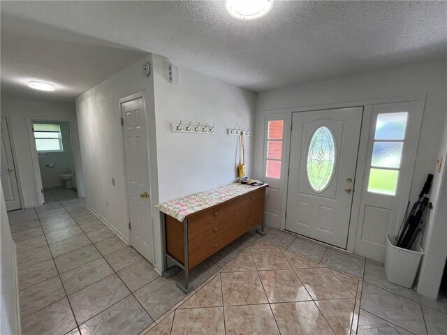 242 Willow Dr, Gretna, LA 70053 - foyer with a textured ceiling and light tile patterned floors