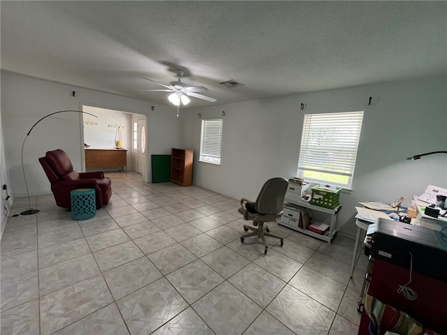 242 Willow Dr, Gretna, LA 70053 - office area with a textured ceiling, ceiling fan, and light tile patterned flooring
