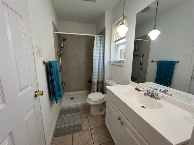 242 Willow Dr, Gretna, LA 70053 - bathroom with a tile shower, vanity, toilet, and tile patterned flooring