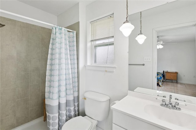 242 Willow Dr, Gretna, LA 70053 - bathroom with vanity, toilet, ceiling fan, and tiled shower