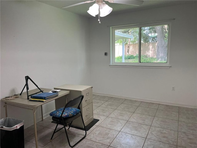 242 Willow Dr, Gretna, LA 70053 - home office featuring a ceiling fan, baseboards, and light tile patterned flooring