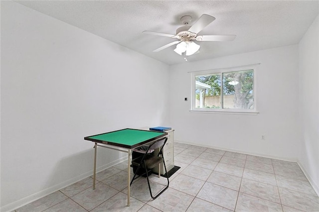 242 Willow Dr, Gretna, LA 70053 - game room featuring a ceiling fan, baseboards, a textured ceiling, and light tile patterned flooring