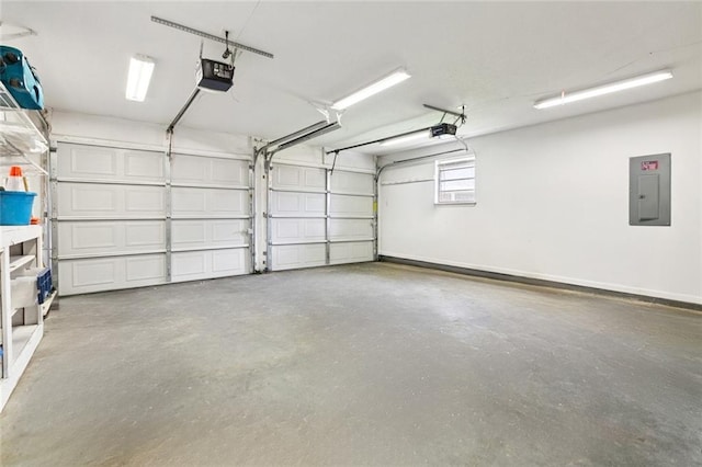 242 Willow Dr, Gretna, LA 70053 - garage featuring electric panel and a garage door opener