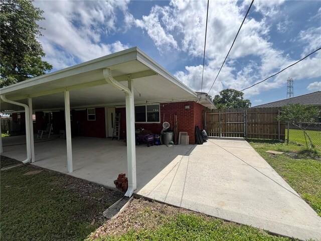 242 Willow Dr, Gretna, LA 70053 - view of patio with fence and an attached carport