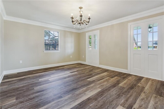 4233 Bordeaux Dr, Kenner, LA 70065 - entryway with a chandelier, plenty of natural light, dark wood finished floors, ornamental molding, and baseboards