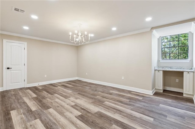 4233 Bordeaux Dr, Kenner, LA 70065 - empty room with ornamental molding, wood finished floors, a chandelier, baseboards, and recessed lighting