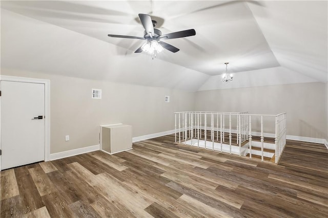 4233 Bordeaux Dr, Kenner, LA 70065 - additional living space with lofted ceiling, wood finished floors, a ceiling fan, baseboards, and a chandelier