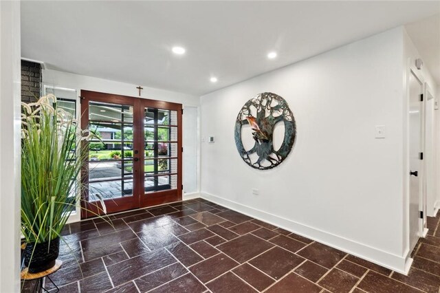 1201 N General Pershing St, Hammond, LA 70401 - foyer entrance with french doors, baseboards, recessed lighting, and stone finish flooring