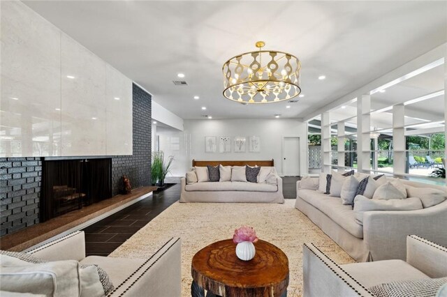 1201 N General Pershing St, Hammond, LA 70401 - living area with a chandelier, a fireplace, and recessed lighting