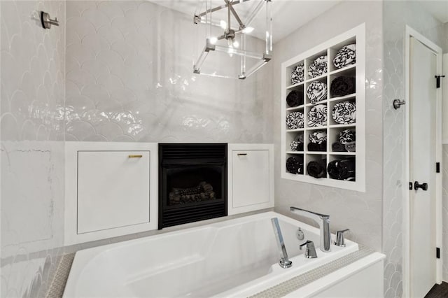1201 N General Pershing St, Hammond, LA 70401 - bathroom with a garden tub and a chandelier