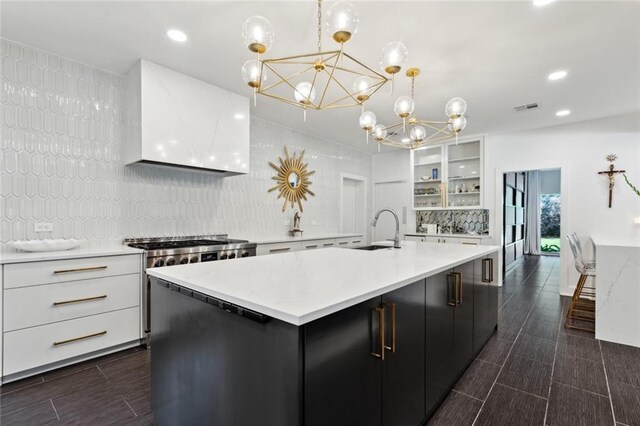 1201 N General Pershing St, Hammond, LA 70401 - kitchen with a sink, a chandelier, custom range hood, white cabinets, and recessed lighting