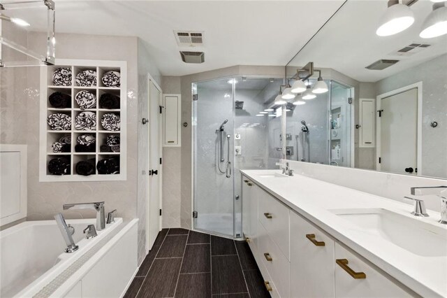 1201 N General Pershing St, Hammond, LA 70401 - bathroom featuring a stall shower, a bath, and double vanity