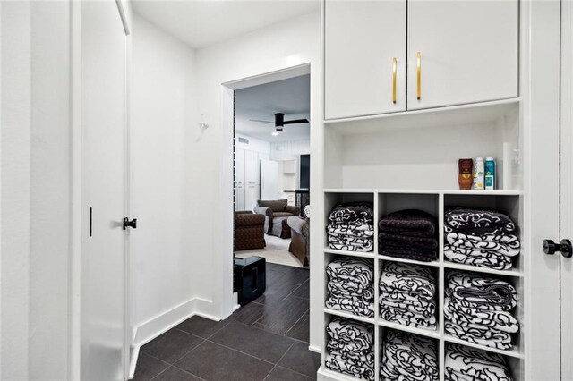 1201 N General Pershing St, Hammond, LA 70401 - hallway featuring dark tile patterned floors and baseboards