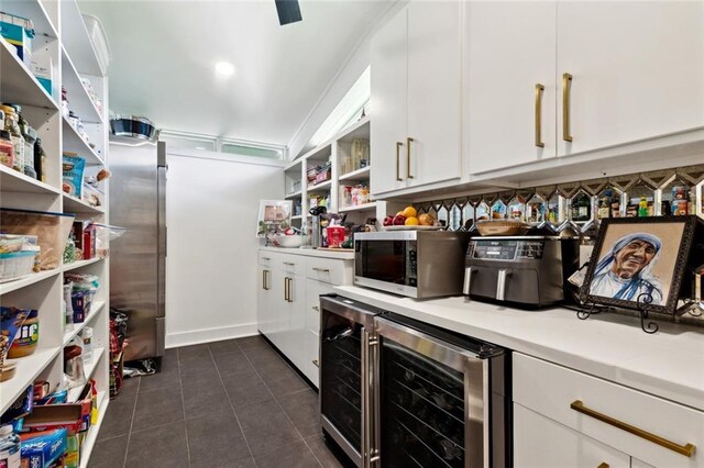 1201 N General Pershing St, Hammond, LA 70401 - kitchen featuring open shelves, wine cooler, stainless steel appliances, and white cabinetry