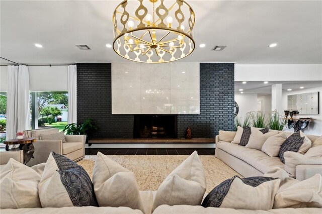 1201 N General Pershing St, Hammond, LA 70401 - living area featuring a fireplace with raised hearth, recessed lighting, and a chandelier