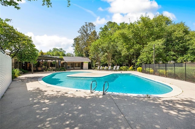 1201 N General Pershing St, Hammond, LA 70401 - view of swimming pool featuring fence, a patio, and view of wooded area